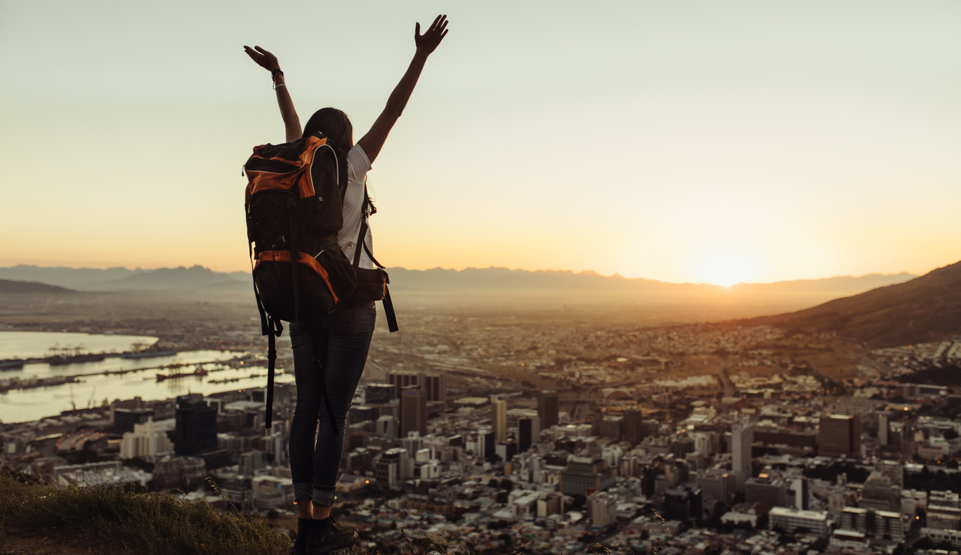 Solo Traveler Enjoying the City View from Hill Top